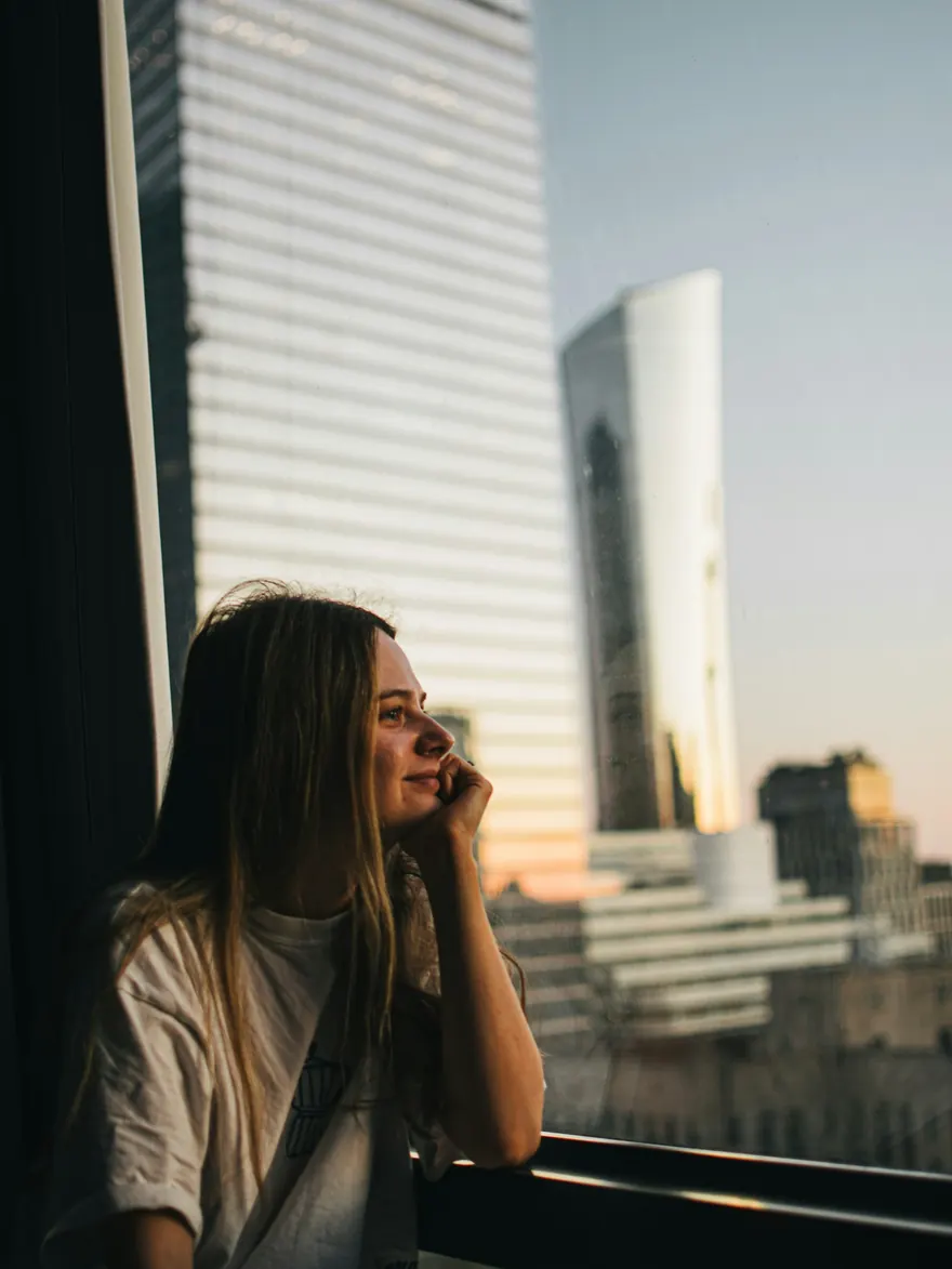 A woman looking out over her new city